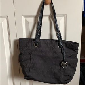 Canvas MK logo tote with protective bag
